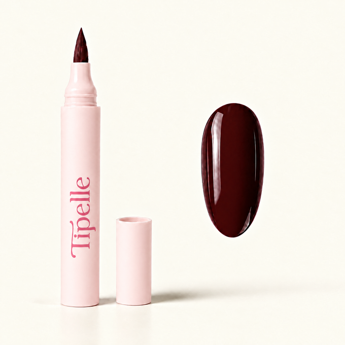 Tipelle chocolate Nail Pen matched warm ivory background